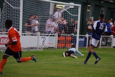 Eccleshill goalkeeper Joe Stead is unable to save Leon Henry's effort