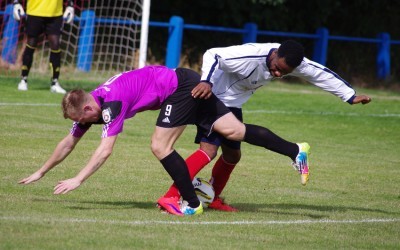 James Walshaw being knocked off the ball