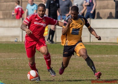 Ossett Town's Sanchez Payne holds off Ossett Albion's Adam Jones in the last meeting. Picture: Mark Gledhill