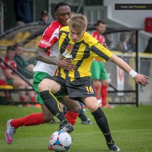 Cameron Lyn attempts to stop Harrogate Town's Jordan Thewlis during the John Smith's Trophy game. Picture: Caught Light Photography