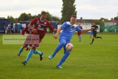 Rossington Main player-manager Lee Holmes holds the ball up. Photo: White Rose Photos