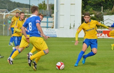 Stocksbridge midfielder Harrison Biggins prepares to close down Farsley's Neil Stevens. Picture: Gillian Handisides 