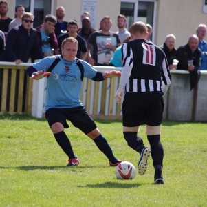 Big moment: Pontefract goalkeeper Craig Parry about to win the battle of wits with Andy Ring