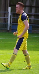 Liam Ormsby punches the air after scoring from the penalty spot