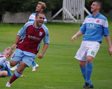 Ash Flynn celebrates one of his goals for AFC Emley this season