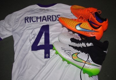 The signed Micah Richards shirt and two signed personalised boots