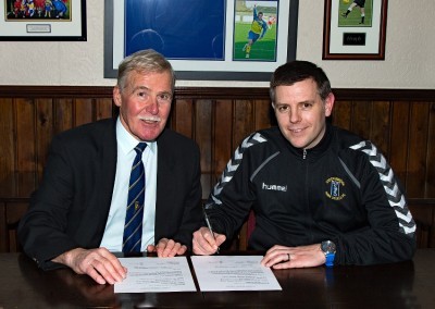 Chris Hilton (right) signs his two-year contract with Stocksbridge Park Steels with secretary Mick Grimmer watching over. Picture: Peter Revitt