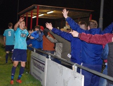 Hemsworth captain Jason Yates high-fives the club's supporters