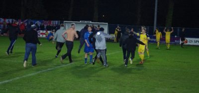 Tadcaster fans invade the pitch after the final whistle sounded