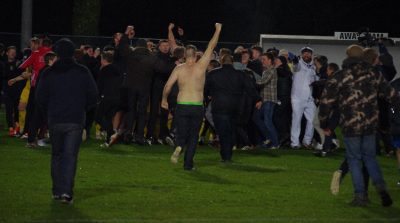 A brave Tadcaster fan run towards the main group of people