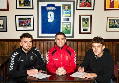 David Reay and Harrison Biggins sign their Stocksbridge contracts with Chris Hilton (centre) watching over. Joe Lumsden (not pictured) has also signed on the dotted line.
