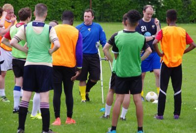 New Garforth Town first team coach Mark Greaves speaks to the trialists 