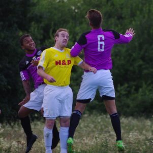 Craig Tonkinson and Spencer Lund jump up for a header