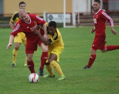 Mick Jones in a tussle with Knaresborough winger Seb Carole. Picture: Craig Dinsdale