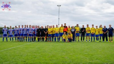 The two teams and officials line up after the game. Picture: Mark Gledhill