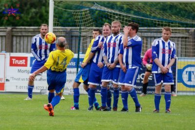 The Bird In Hand's wall looks terrified as dangerous Dave Robertson takes a free kick. Picture: Mark Gledhill