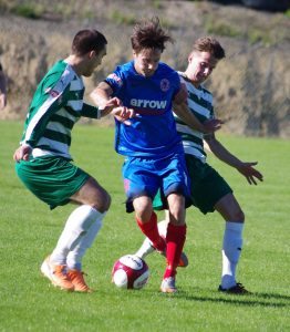 Kieran Lugsden being shepherded by two Northwich defenders 