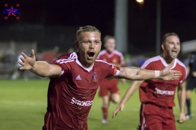 The hero: Danny Frost celebrates booking Ossett Town's plum FA Cup tie with FC United of Manchester in September. Picture: Mark Gledhill