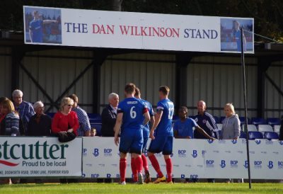 Shaw Lane's players begin to walk over to Dan's parents after the game