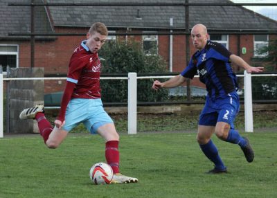 Joe Brennan crosses during AFC Emley's FA Vase defeat to Cleethorpes. Picture: Mark Parsons