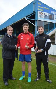 Non League Yorkshire's James Grayson presents Stocksbridge striker Joe Lumsden with the October Player of the Month Trophy. Chris Hilton holds the bottle of red wine