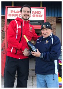 Bridlington Town goalkeeper James Hitchcock collects his prize for appearing in 100 consecutive games for the club